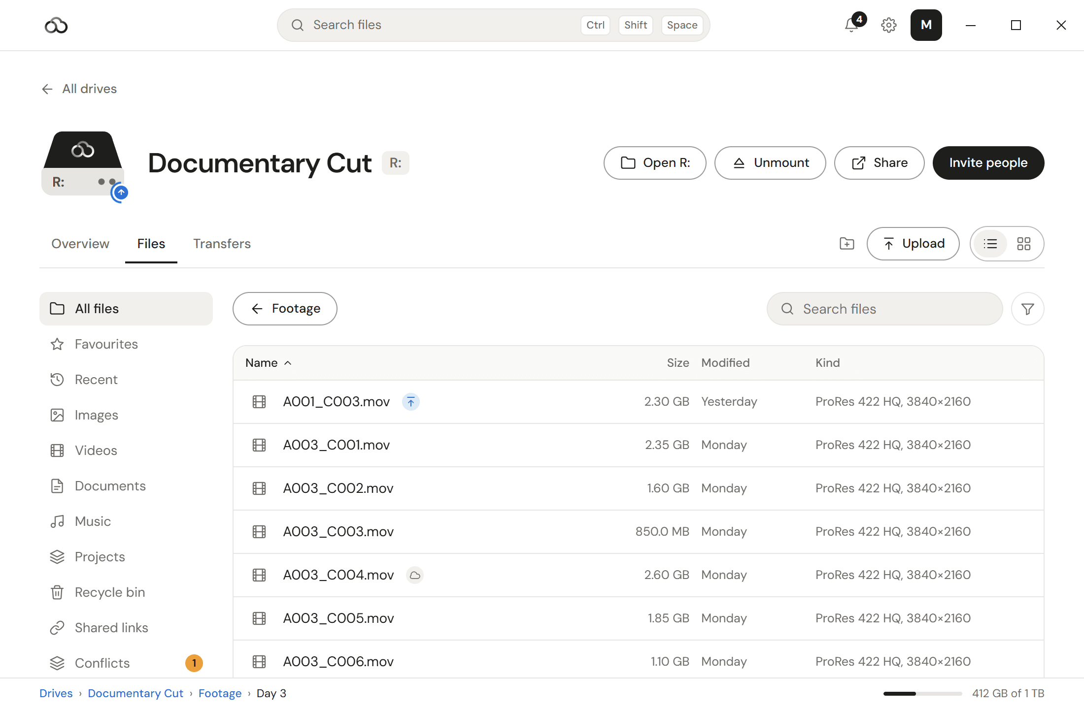 The ReachFS app on a drive mounted as R:, showing a folder of ProRes camera clips with their sizes, and marks for a clip still uploading and one that is online only.